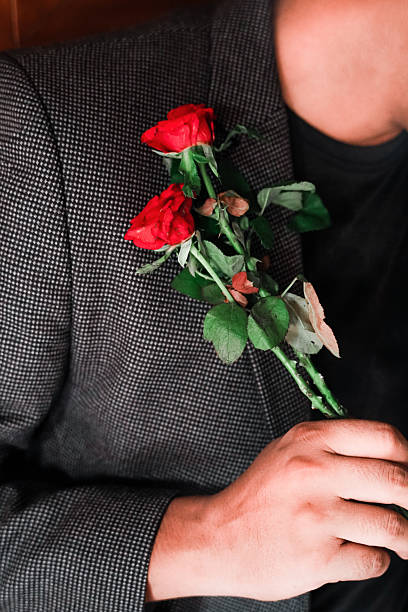 istock Man Holding Red Roses: Romance and Elegance 2232376257