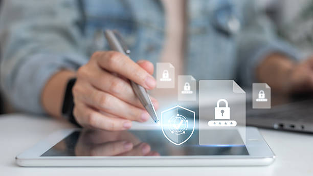 istock Hand using a tablet with a stylus and a hologram lock file icon. Concepts of cybersecurity, data protection, file encryption, online privacy, secure digital system, safety network, and IT security. 2232376801