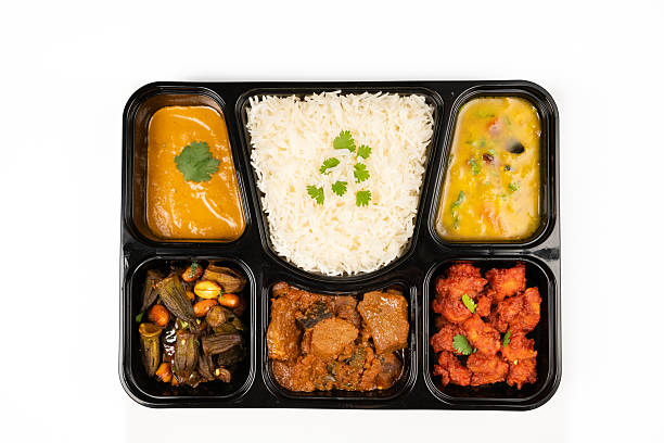 istock Traditional Indian Thali Served in a Black Tray with Assorted Dishes 2232380690