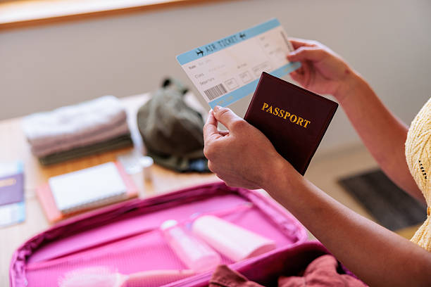 istock Passport and Boarding Pass Above Suitcase 2232381117