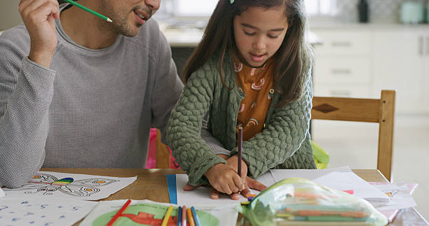 istock Drawing, hands and dad with child in home for learning colors, creative activity and homework together. Family, bonding and father with girl in house with paper for education, development and help 2232381617