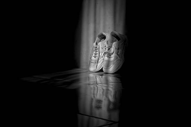 A pair of shoes in a low light room