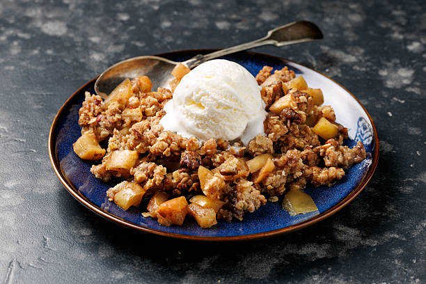 istock Freshly baked apple crumble pie with ice cream 2232385115