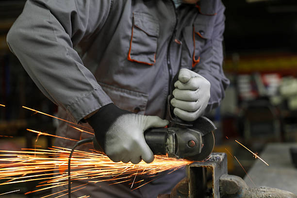 istock Factory Worker Cutting Metal Pipe with Angle Grinder in Workshop 2232386746