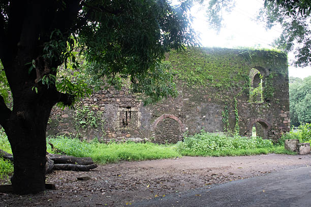 istock moss covered stone wall of vasai fort or bassein fort with arched openings 2232388115