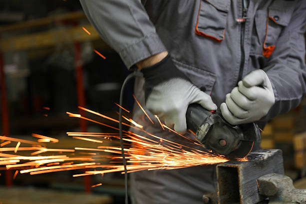 istock Technician in Workshop Grinding Metal Equipment Safely 2232389050