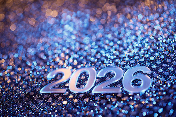 istock Silver 2026 Numbers on Sparkling Blue Festive Surface with Holiday Bokeh 2232392762