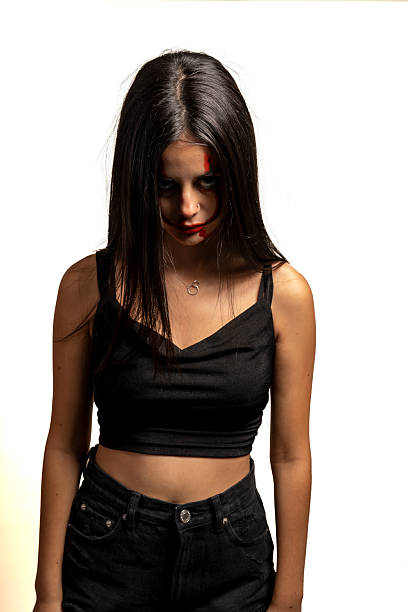 istock Haunting Gaze: Young Woman with a Chilling Halloween Expression 2232393738