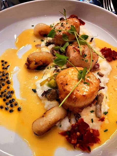 Scallops with sauce and garnish