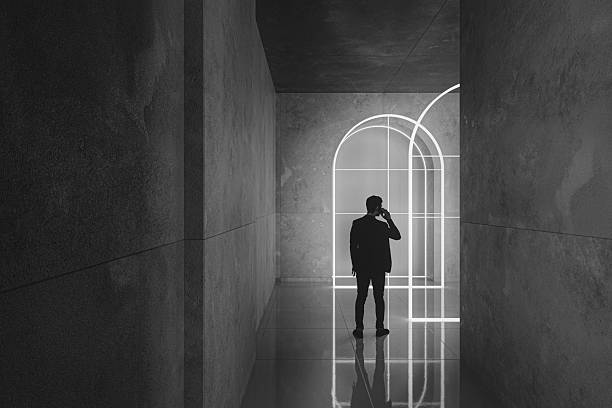 istock Man in urban concrete corridor 2232400864