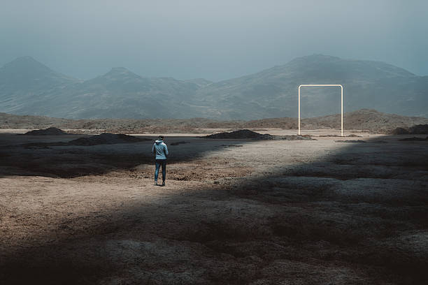 istock Young man walking in surreal landscape 2232400986