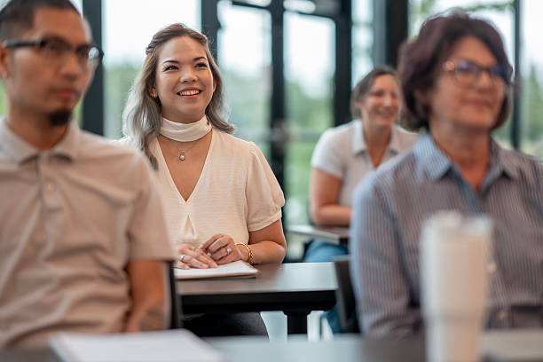 istock Diverse Group of Adults Engaged in Professional Training or Workshop Setting 2232403455