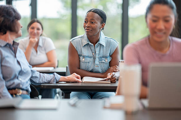 istock Diverse Group of Adults in a Collaborative Learning Environment 2232403886