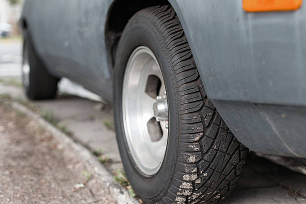istock Car tire on old vintage automobile 2232405894