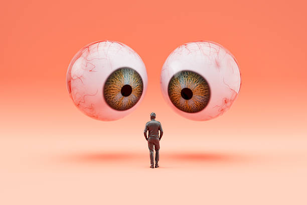 istock Internet Privacy Concept, Giant Eyeballs Watching Over a Human Figure 2232406452