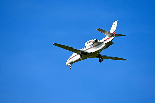 Chantilly, Virginia, USA - June 23, 2025: A NetJets Cessna Citation XLS business jet prepares to land at Washington Dulles International Airport.