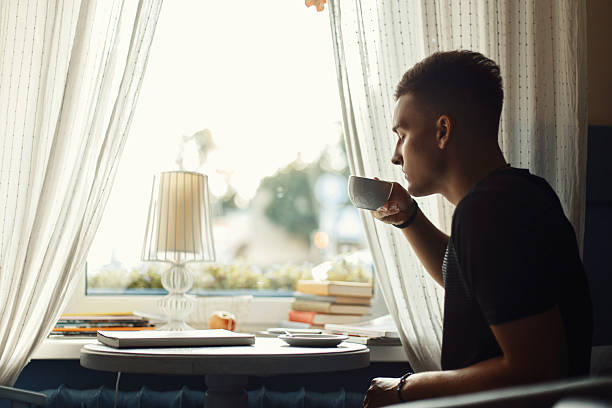 istock Handsome man drinking coffee in a restaurant. 2232410729