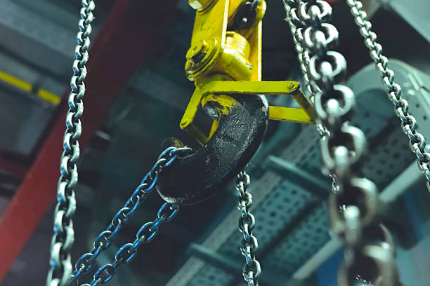 istock Lifting chains for hoisting cargo with crane hook. Chain on the hook. 2232412054