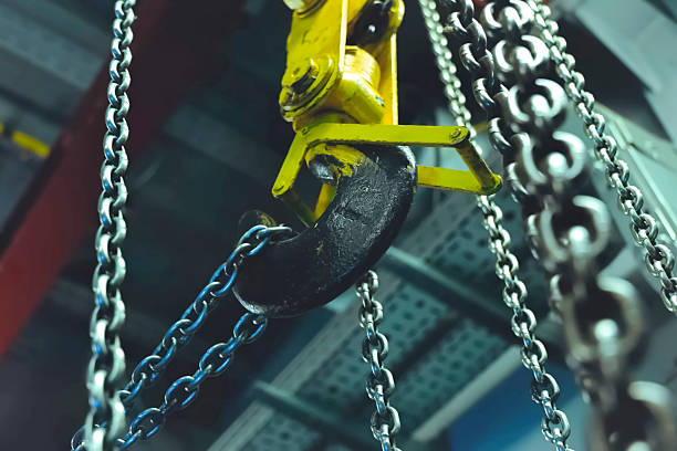istock Lifting chains for hoisting cargo with crane hook. Chain on the hook. 2232412071