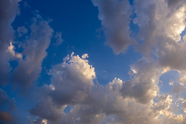 clouds at sunset or sunrise. blue sky.