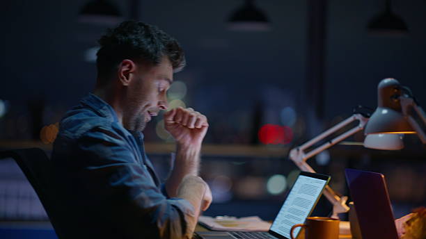 istock Overworked late worker yawning texting computer indoors closeup. Overtime job 2232413867