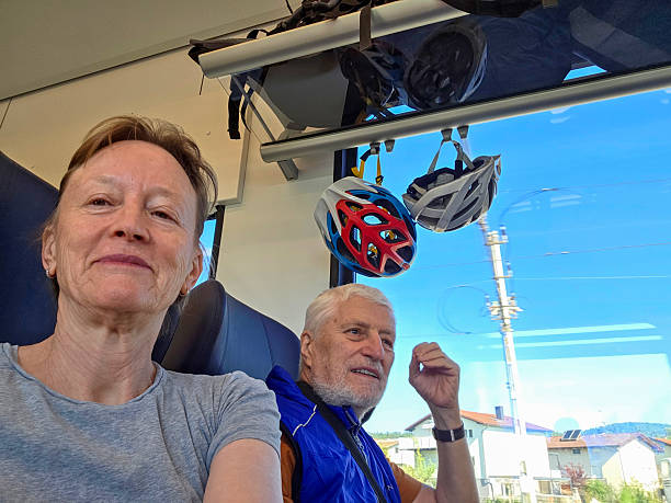 istock Senior couple on the train with sport helmets 2232414074