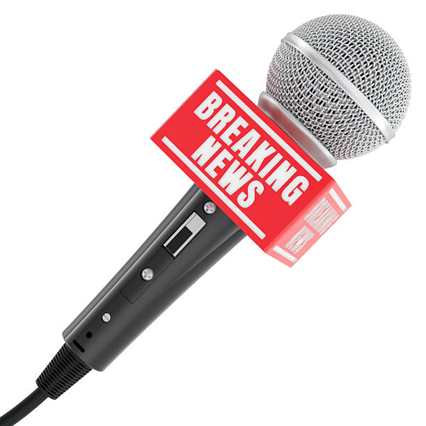 istock Breaking News, concept. Black microphone with red breaking news label. 3D rendering 2232414399