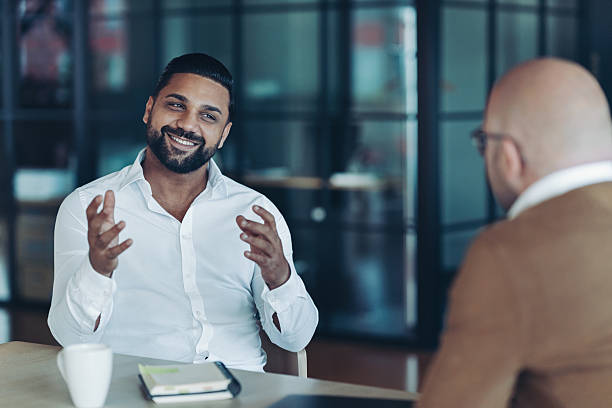 istock Businessman talking to a client 2232416658