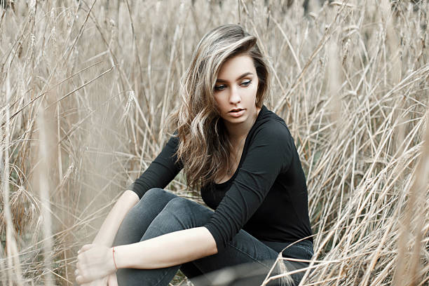 istock Beautiful girl in dry grass. 2232416864