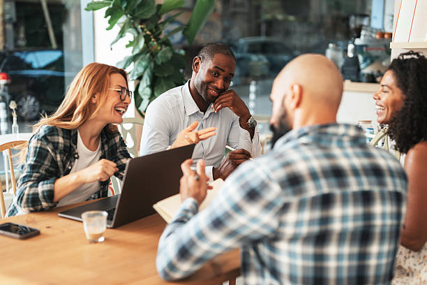 istock Team having informal meeting in coffee shop 2232417854