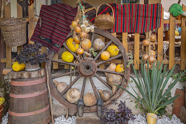 Gabrovo, Strumica, North Macedonia. Decorative display of gourds and squashes with a wagon wheel.