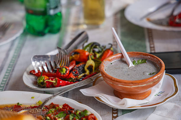 Novaci, Pelagonia, North Macedonia. Lunch with roasted peppers and a savory sauce.