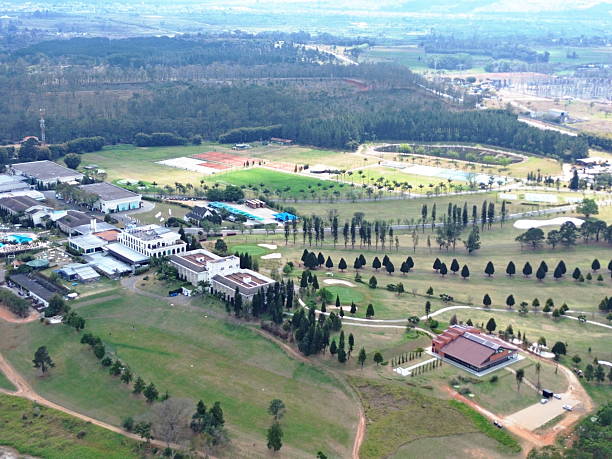 istock Buildings, green grass and trees 2232421024