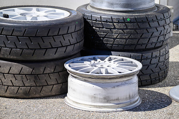 Used and New Racing Tires at a Racetrack. Concept The cycle of competition.
