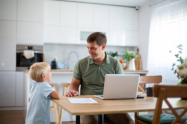 istock Father working from home and interacting with his son 2232429994
