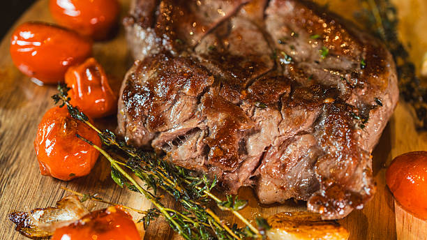 Close Up Juicy Medium Rare Ribeye Steak with Homemade Fries and Thyme