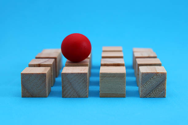 istock Red leader sphere on wooden cubes 2232433397