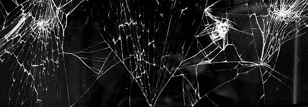 istock cracked glass isolated in black background 2232434610