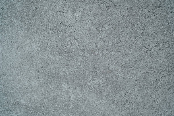 istock Blue toned concrete wall texture background with fine details and surface grain 2232435459