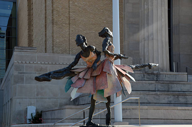 Lots of  multi-colored globules and bubbles forms a male human figure. A man is dancing on a black background. A three dimensional digitally generated picture