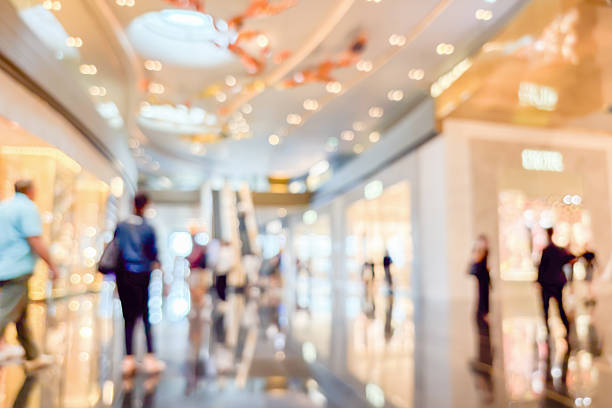 modern luxury shopping mall department store interior blur abstract background with bokeh light
