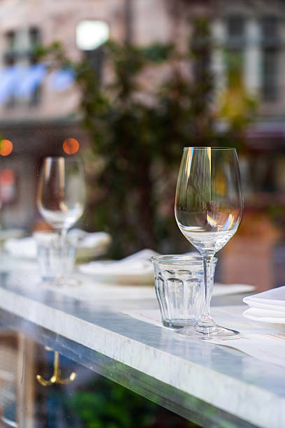 istock Empty wine glasses sitting on a restaurant table in stockholm 2232438882