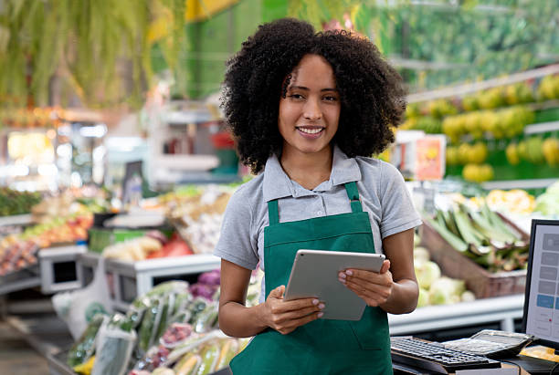 istock Employee working at the supermarket using a digital tablet 2232441345