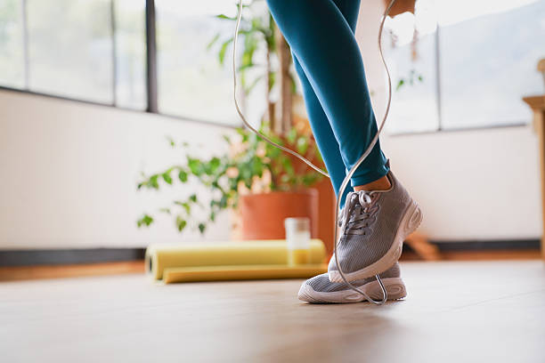 istock Woman jumping rope at home 2232443077