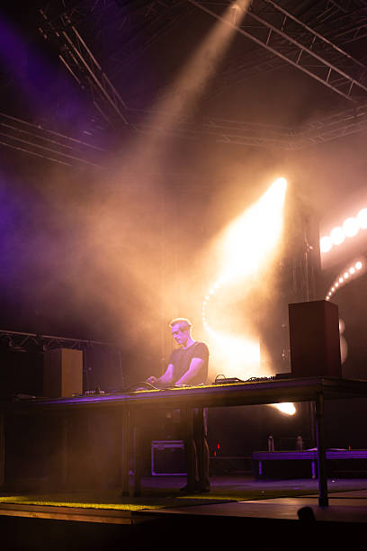 istock Dj playing techno music on the stage 2232443168