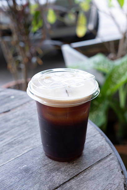 istock Refreshing ice americano coffee on table, black coffee with ice on table 2232444655