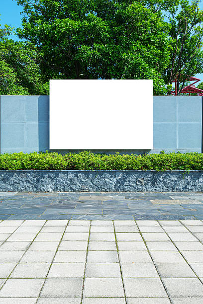 istock Blank billboard on the stone brick wall in public park 2232447788