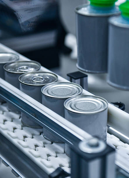 istock Canned food products on conveyor belt in distribution warehouse 2232447876