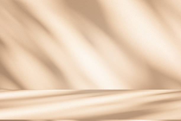 istock Studio style background wall decoration presentation uses white and beige tones. with shadows cast from a nearby window, concept creating a decorative 2232448543