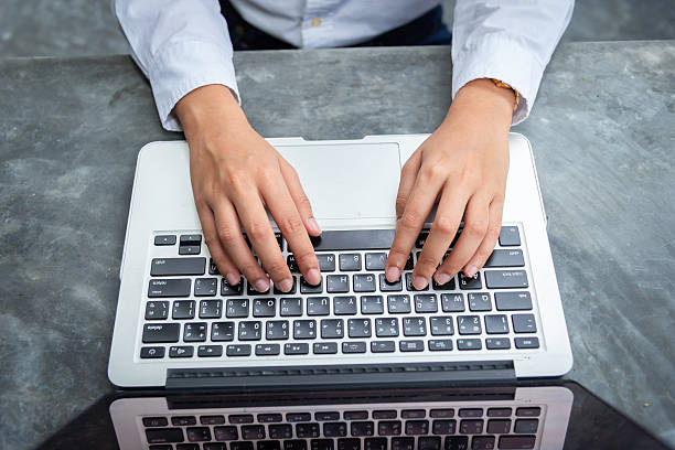 istock Business documents on office table with smart phone and laptop computer and graph financial with social network diagram and three colleagues discussing data in the background 2232451193